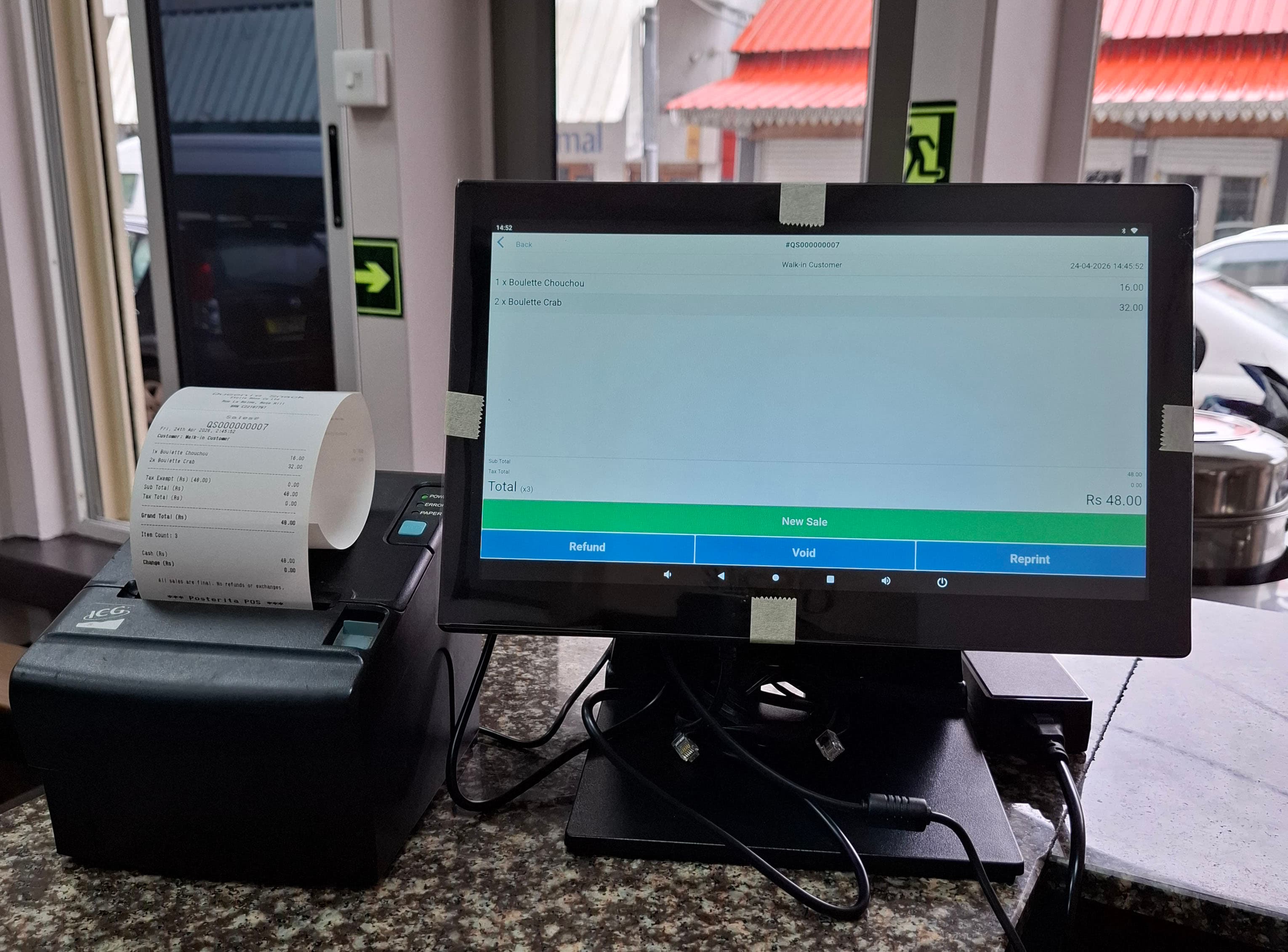 Posterita POS terminal with receipt printer at a food business counter in Mauritius